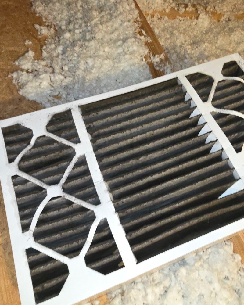Dirty HVAC air filter showing dust buildup that can restrict airflow and indoor air quality